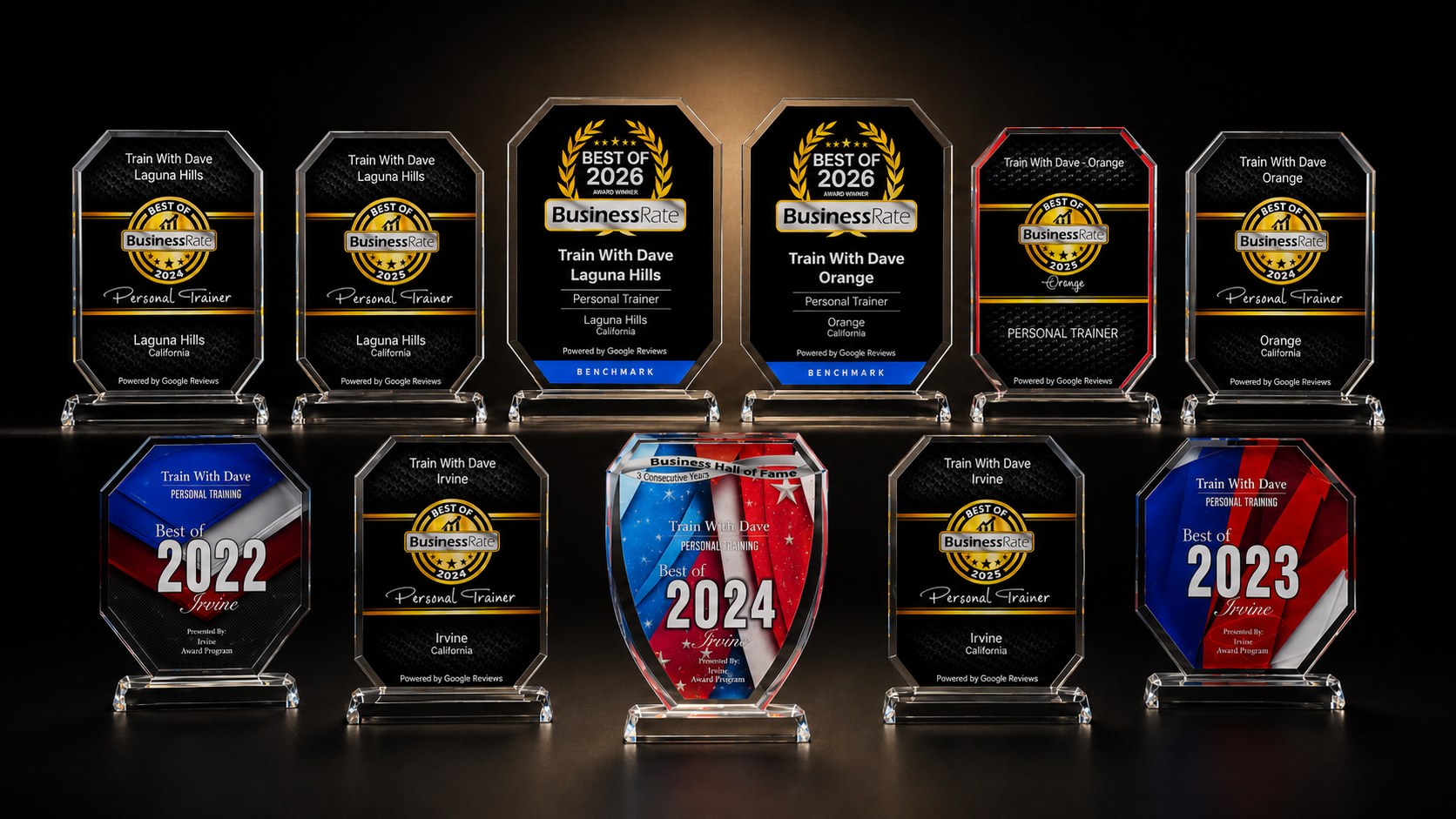 Train With Dave trophy collection — eleven award plaques including Business Rate Best of 2026 (Orange + Laguna Hills), Best of 2024 and 2025 across all three studios, Best of Irvine 2022 and 2023, and the Irvine Business Hall of Fame